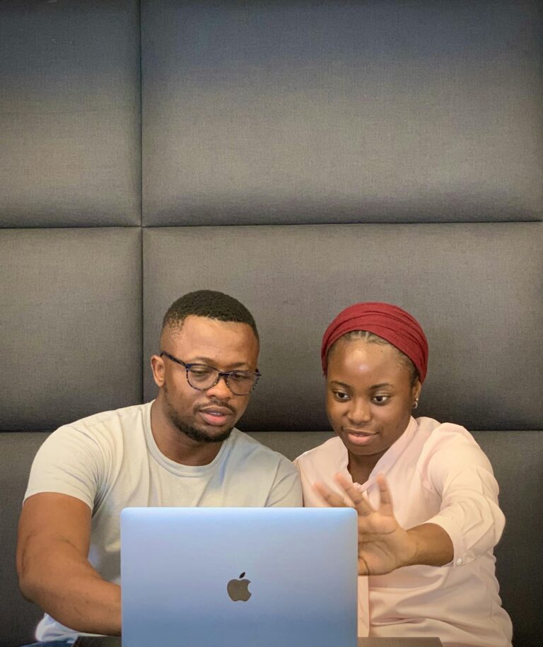 A Couple Using a Laptop